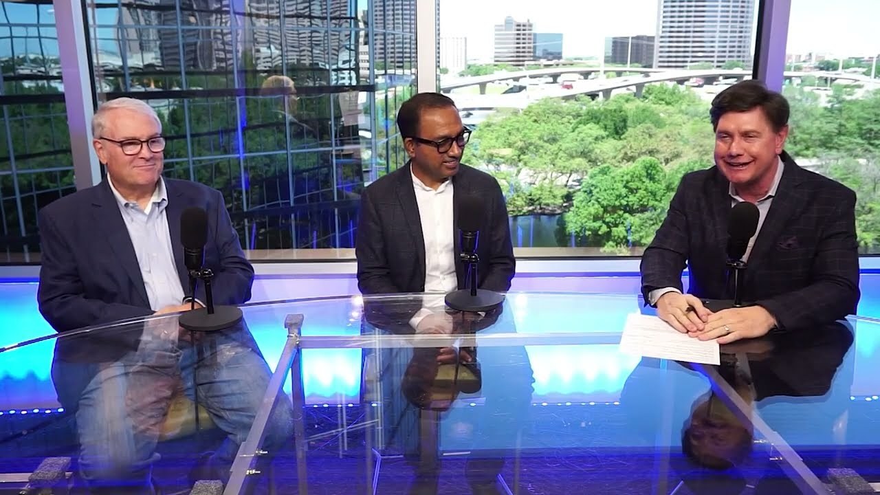 Three men seated at a studio desk with microphones during The Jeff Crilley Show