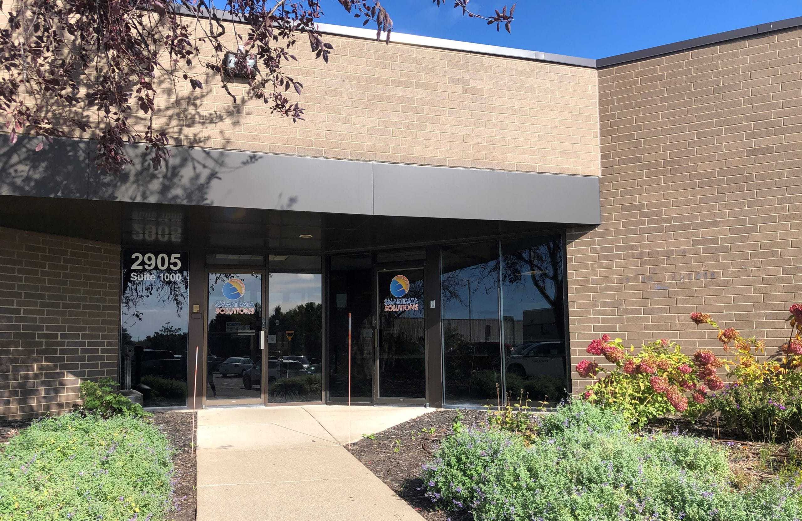 Smart Data Solutions office entrance with the company logo on the glass doors