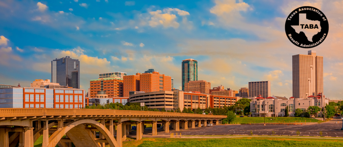 TABA Texas Association of Benefit Administrators logo over a city skyline at sunset