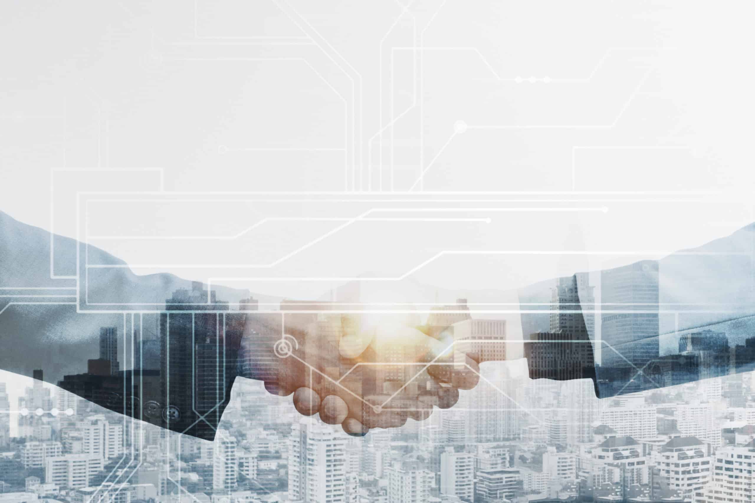 Handshake overlaid on a city skyline and circuit lines, symbolizing a technology partnership