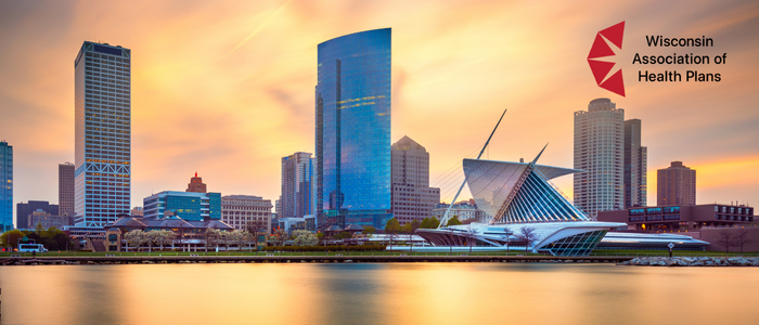 Milwaukee skyline at sunset with the Wisconsin Association of Health Plans logo