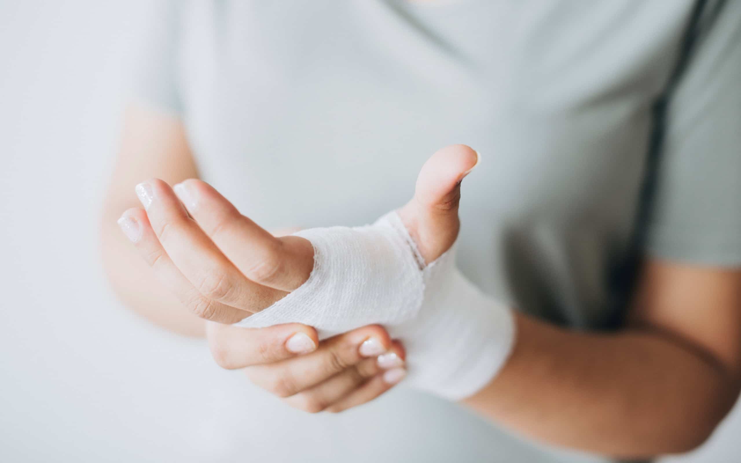 Person holding a bandaged wrist